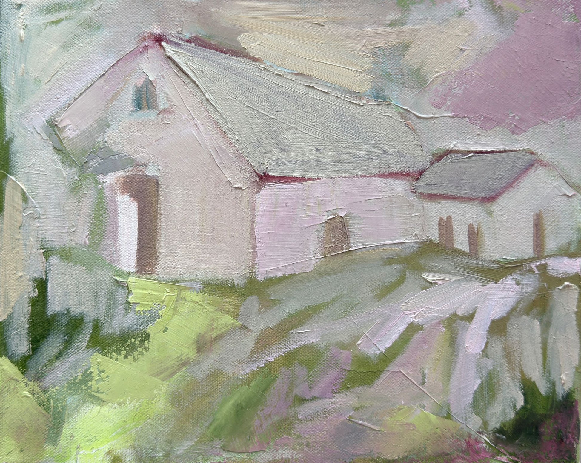 Original oil painting of pale barns on a green hillside under a soft mauve sky from the Home series by Tamar Green